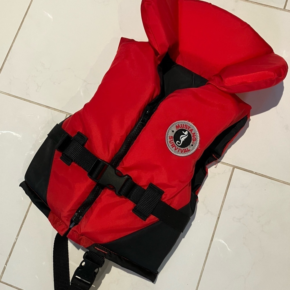 Mustang survival red youth life jacket.  Like new !